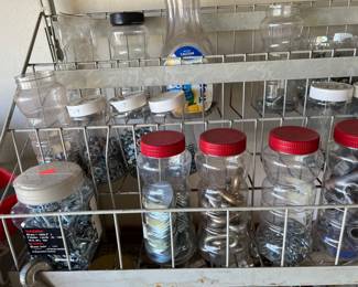 Jars full of miscellaneous nuts, bolts, screws, washers, nails, etc.