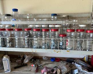 Jars full of miscellaneous nuts, bolts, screws, washers, nails, etc.