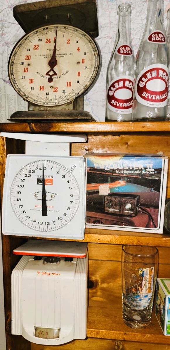 Antique scales, old soda bottles