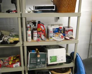 We have a nice shelving unit, and a picnic basket, and a laundry basket, and some boxes of other things
