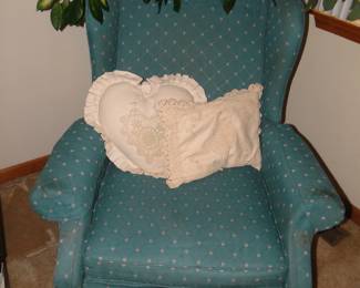 Comfortable wingback chair, and large house plant