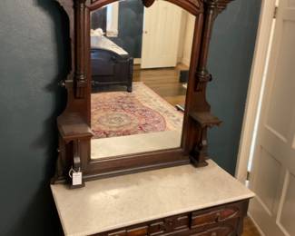 Antique renaissance dresser with mirror and marble top. 