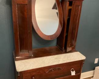 Antique dressing table with marble top and mirror.  