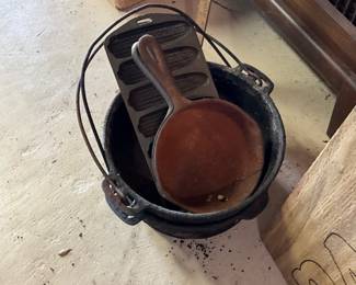 Cast Iron pots, skillets and Cornbread items.