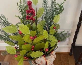 Green Vase with holiday decorations.
