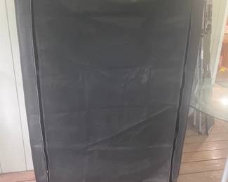 Metal shelf with cloth cover. 