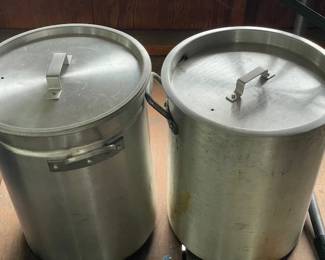 Large metal cooking pots.
