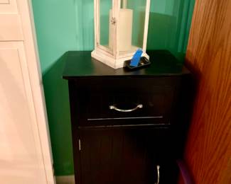 Small black table and lantern 