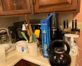 Various kitchen items - Soda stream, microwave, and water pik
