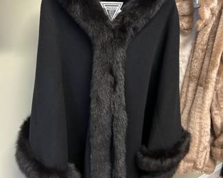 #144	Marvin Richards (one size fits all) Black wool Coat w/black Fox trim	 $100.00 
