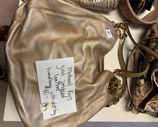 #139	Michael Kors gold pebbled leather handbag w/dustbag	 $40.00 
