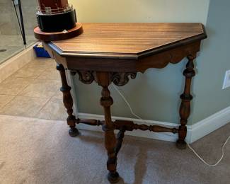 #104	Wood Half Octogen Table - 31x16x30	 $75.00 
