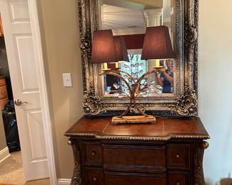 #24	3 Curved Front Chest w/Ball & Claw Feet w/Gold Accents - 40x20x33	 $275.00  sold
#25	Double Lamp w/Metal Base w/glass prisms - 27" Tall	 $125.00 
#26	Heavy Wood Gilded framed Beveled Rectangular Mirror - 30x51	 $175.00 
