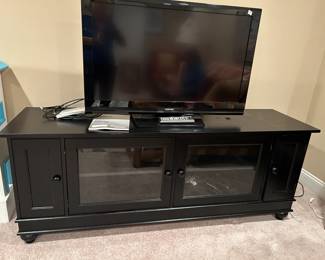 #86	Toshiba 40" TV w/remote	 $75.00 
#87	Black Laminate TV Cabinet w/2 glass Doors and 2 other doors w/cd holders - 72x20x26	 $75.00 
