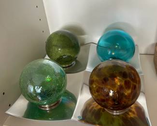 #42	4 glass balls on metal tray - 10x10	 $40.00 
