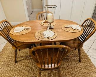 oak kitchen table and 4 chairs.   Table is 36" wide by 54" long.  Solid top, no leaf.