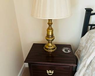 bedside table and brass lamp