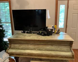 Piano - large flat screen TV
