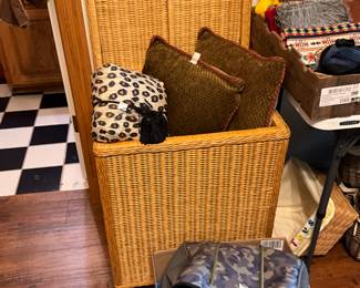 Purses & pillows. - large basket holding pillows removed by family