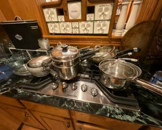 Kitchen - pots, pans, skillets, large container for spices above cook wear, large S/P set