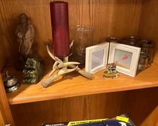 Contents of wall unit - candle in horns removed by family