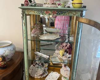 Small shorter decorative curio cabinet, assortment of Porcelain statues