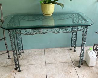 Gorgeous detail wrought iron table with glass top, beautiful scrolling detail.