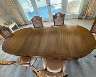 Dining room table (shown with 2 leaves), 6 chairs and pads. Table measures 66" with (2) 18" leaves
