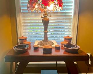 Unique accent table and Tiffany style lamp.  Sanyo sub woofer underneath.