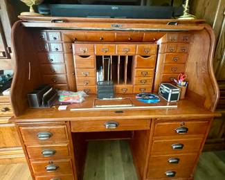 Semi 65” TV and Roll top desk with removable center cub section.