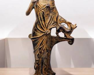 Bronze sculpture of a woman petting a cat