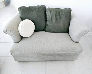 Oversized arm chair with ottoman (not pictured) folds out in to a twin bed 