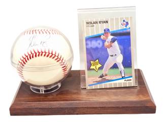 Nolan Ryan baseball card with signed Nolan Ryan baseball. Has not been authenticated
