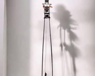 Interesting statue. Little information behind its origin however it seems to be a tall figure on Wheels rolling a hanging person. Very interesting statue