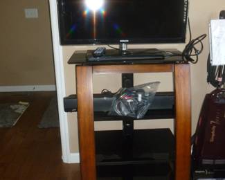 Samsung Tv w/sound bar & contemporary stand (priced separately)