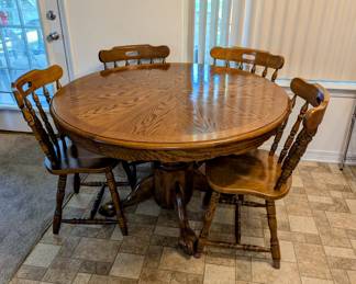 Round Kitchen Table and six Chairs - $260 - 41" across, 30" tall.  Includes a 36" leaf - when inserted will make nice long oval table.  There are 6 chairs -only 4 are shown.  