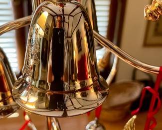 Large collection of silver bells for Christmas most wind up and play music there is a pricelist included