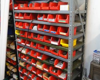 Bins of parts, and drawers, and metal shelving too