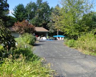 Way back yonder behind the house.  Follow the parking attendant, as to where to park