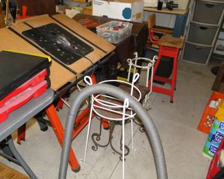 Just a random picture of a few plant stands a vacuum hose