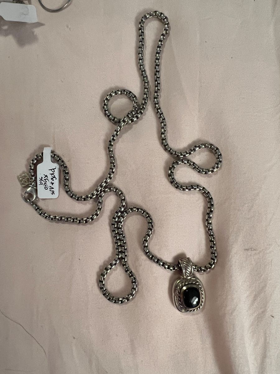 Authentic David Yurman necklace with black onyx. Gold and silver pendant and box chain.