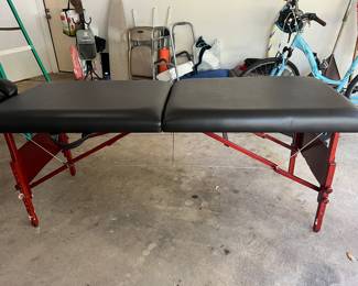 Folding massage table