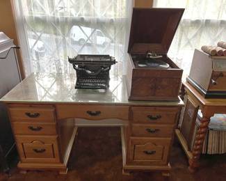 This sale has a lot of vintage items, including the Underwood typewriter and Victrola record player sitting on top of the glass-topped desk.