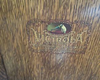 This emblem of Victrola belongs to one of the pieces in the sale.