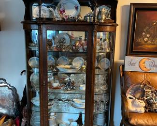 This china cabinet is available, as are the dishes inside.