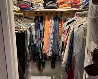 This is another of the two walk-in closets.  There are lots of clothes in both.