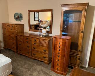 Here is an overview of several bedroom pieces: two dressers, a mirror, a lingerie cabinet, and a display cabinet.