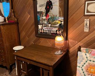 One of the interests that can be seen in this sale is in vintage bicycles.  The wall mirror here is a part of that collection.  Of course the table is also worth a look.  Look carefully on the right at the blanket hanging rack.