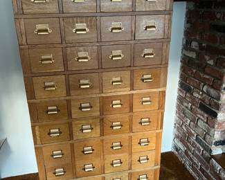 This card catalog-style or modern apothecary's cabinet is shown here.  By the way, 4 columns of 10 rows = 40 drawers.