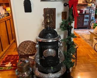 The front of the stove says Oakdale.  Probably can't do a lot of cooking on it, but it looks great!  And don't forget the "holiday" themed lamppost or the milkcan with the stickers on it.
